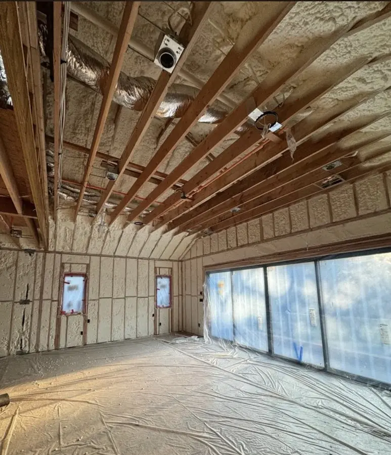 Interior walls and ceiling insulated with spray foam during new construction in North Kingstown
